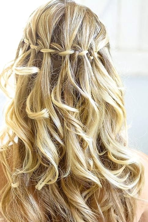 27 Half Up Hairstyles For Long Hair for the Ultimate Glow Up 19 Boho Waterfall Braid