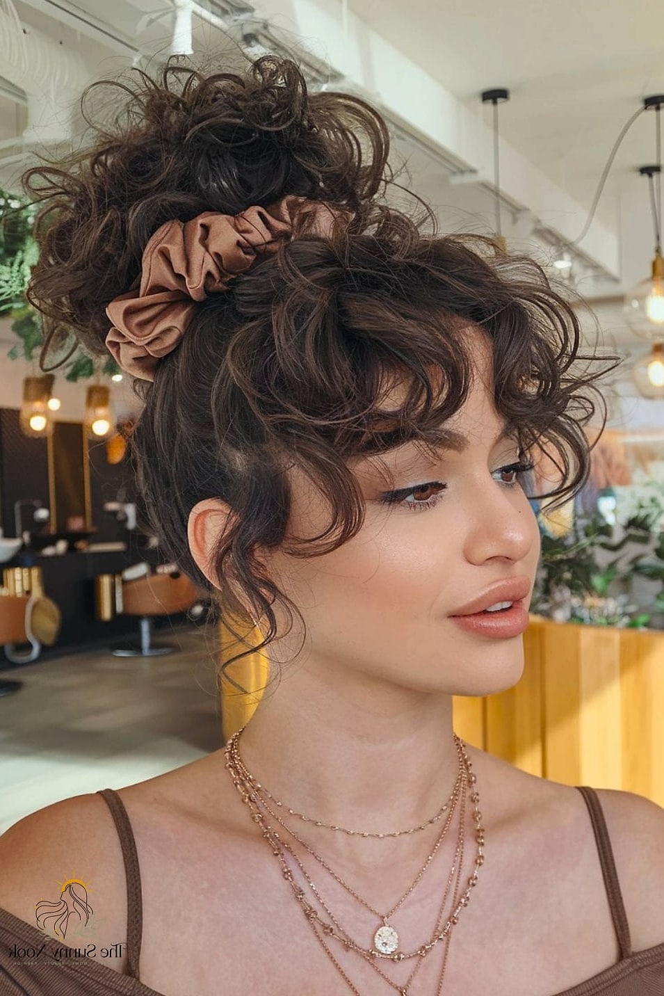 23 Hairstyles For Thick Curly Hair Looks That Will Seriously Inspire You 21 Bouffant Bun with a Headband