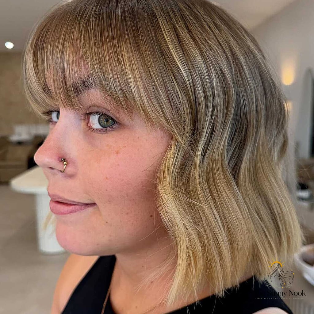 10 90S Curly Hairstyles to Save Before They Blow Up 9 Bronde Wavy Bob with Wispy Bangs