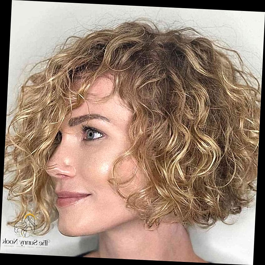 25 Hairstyles Short Curly Hair That Belong on Your Inspiration Board 15 Chin-Length Ringlets with Swooped Bangs