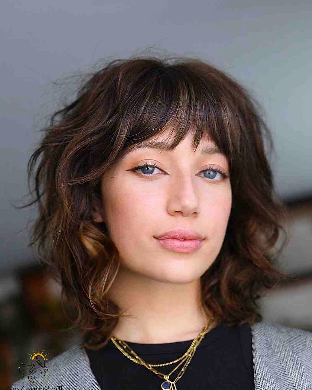 9 Short Hair With Bangs Hairstyles for the Ultimate Glow Up 7 Choppy Wavy Pixie Bob