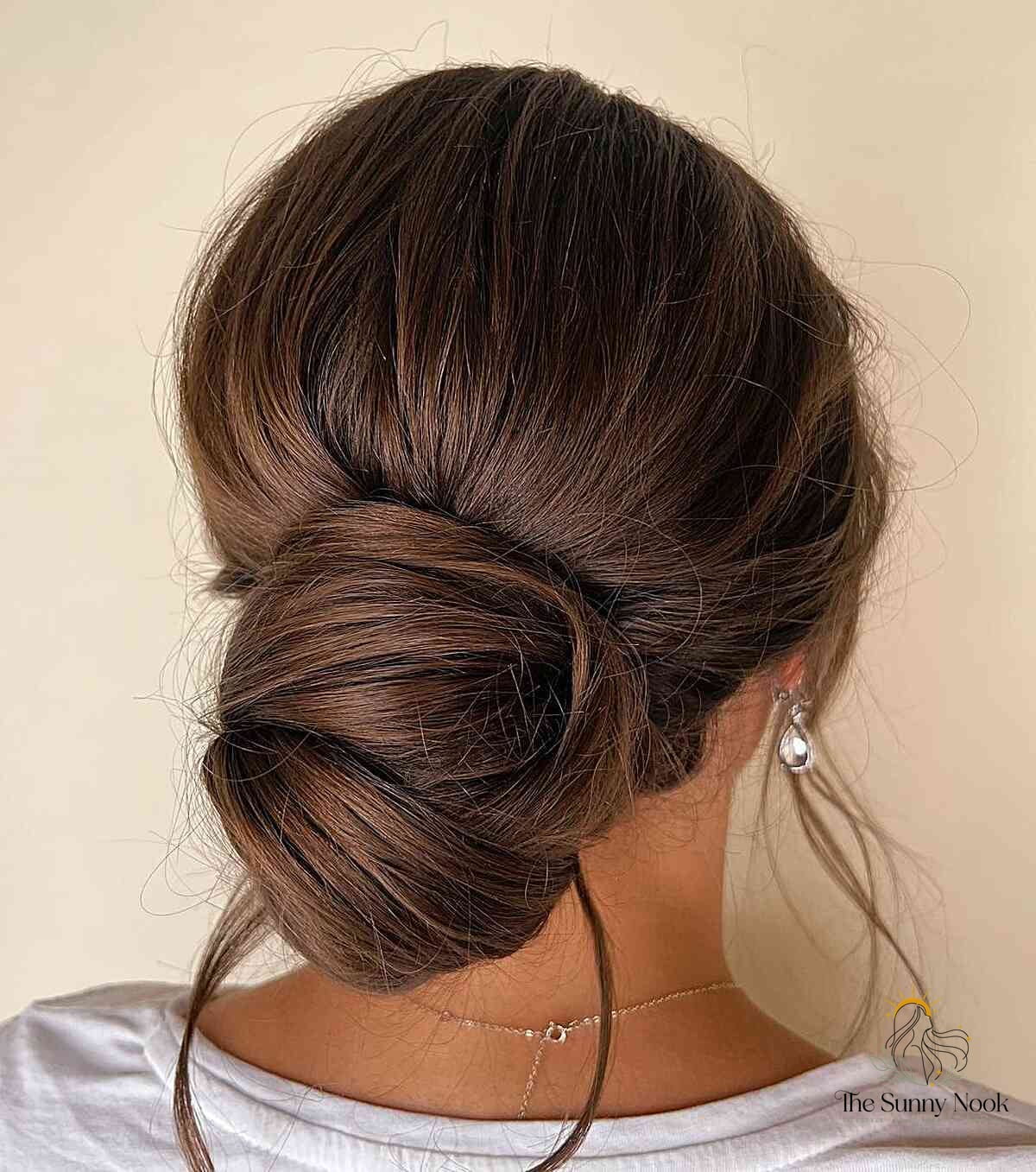 19 Curly Hairstyles Easy That Are Actually Easy to DIY 4 Classic Loose Bun on Brunette Hair