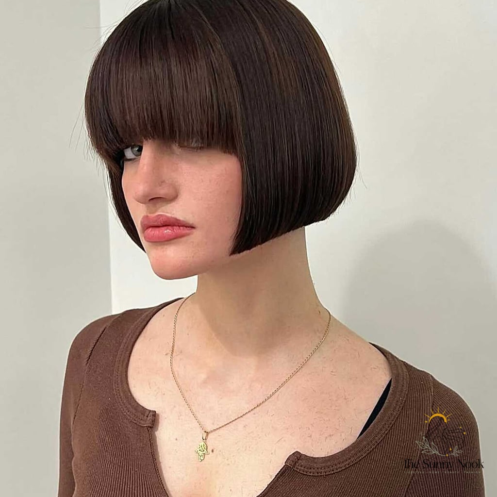10 90S Curly Hairstyles to Save Before They Blow Up 4 Dark Chocolate French Bob with Baby Bangs