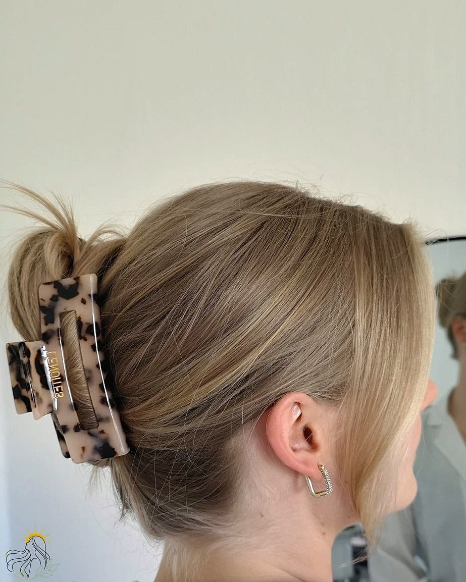 19 Claw Clip Hairstyles Curly Hair Ideas You Need to Try Right Now 13 Deep Side Part Claw Clip Updo