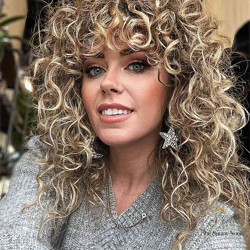 9 Short Hair With Bangs Hairstyles for the Ultimate Glow Up 3 Flattering Curly Layered Haircut with Long Bangs