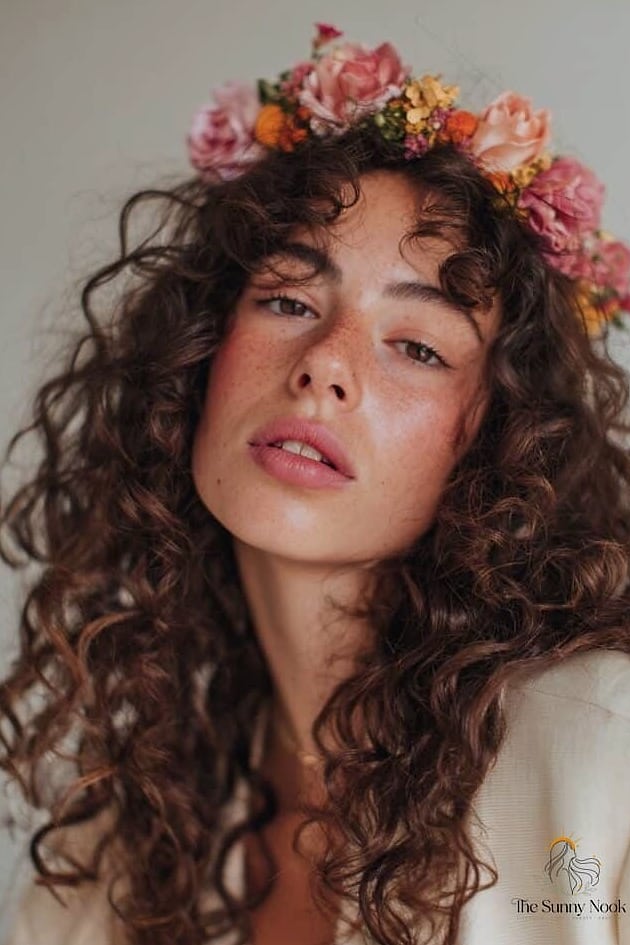 21 Headband Hairstyles Curly Hair Everyone Is Pinning Right Now 14 Floral Headband for Spring Curls