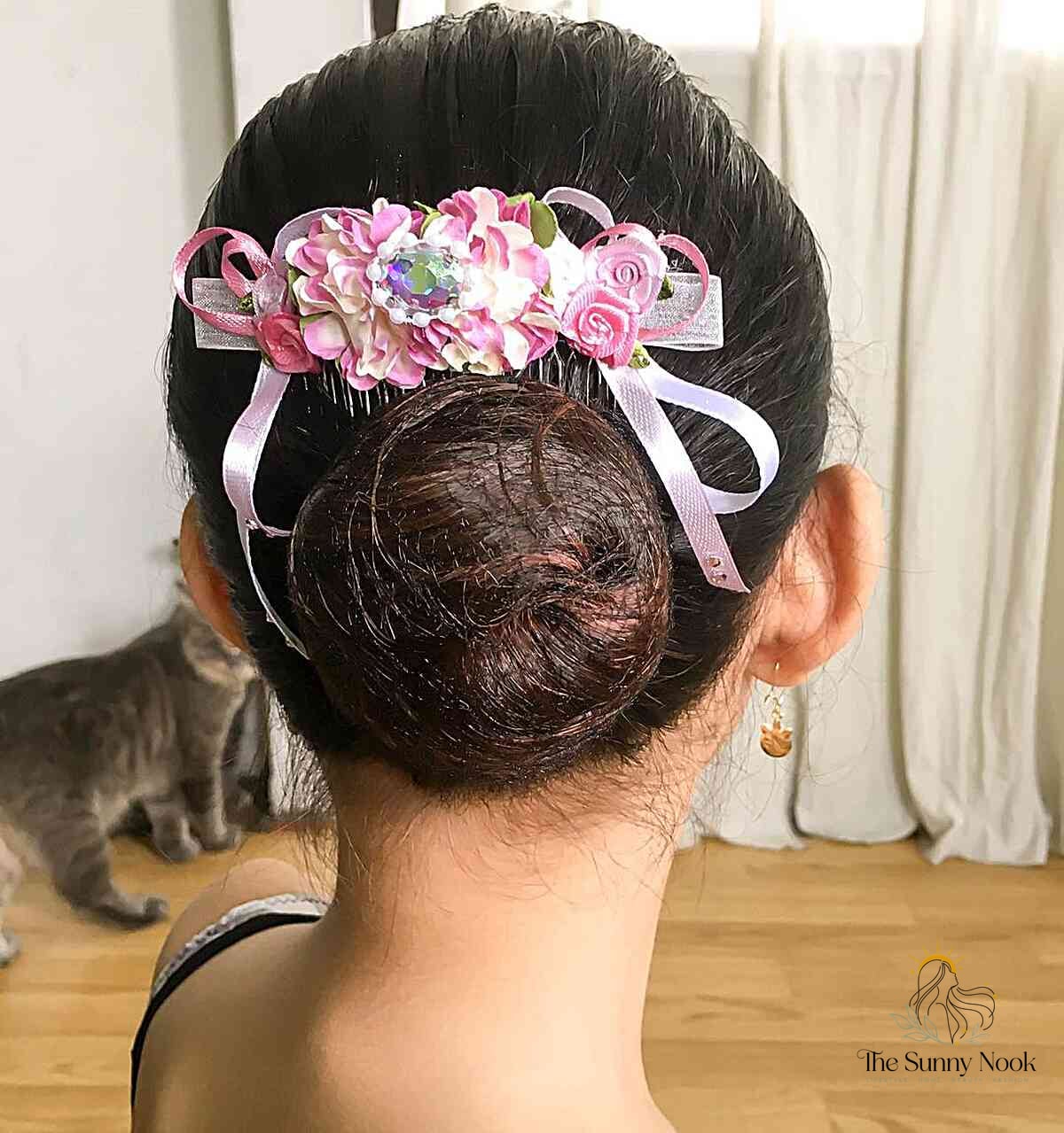 27 Slick Bun Hairstyles We're Obsessed With Right Now 25 Floral Sleek Low Bun