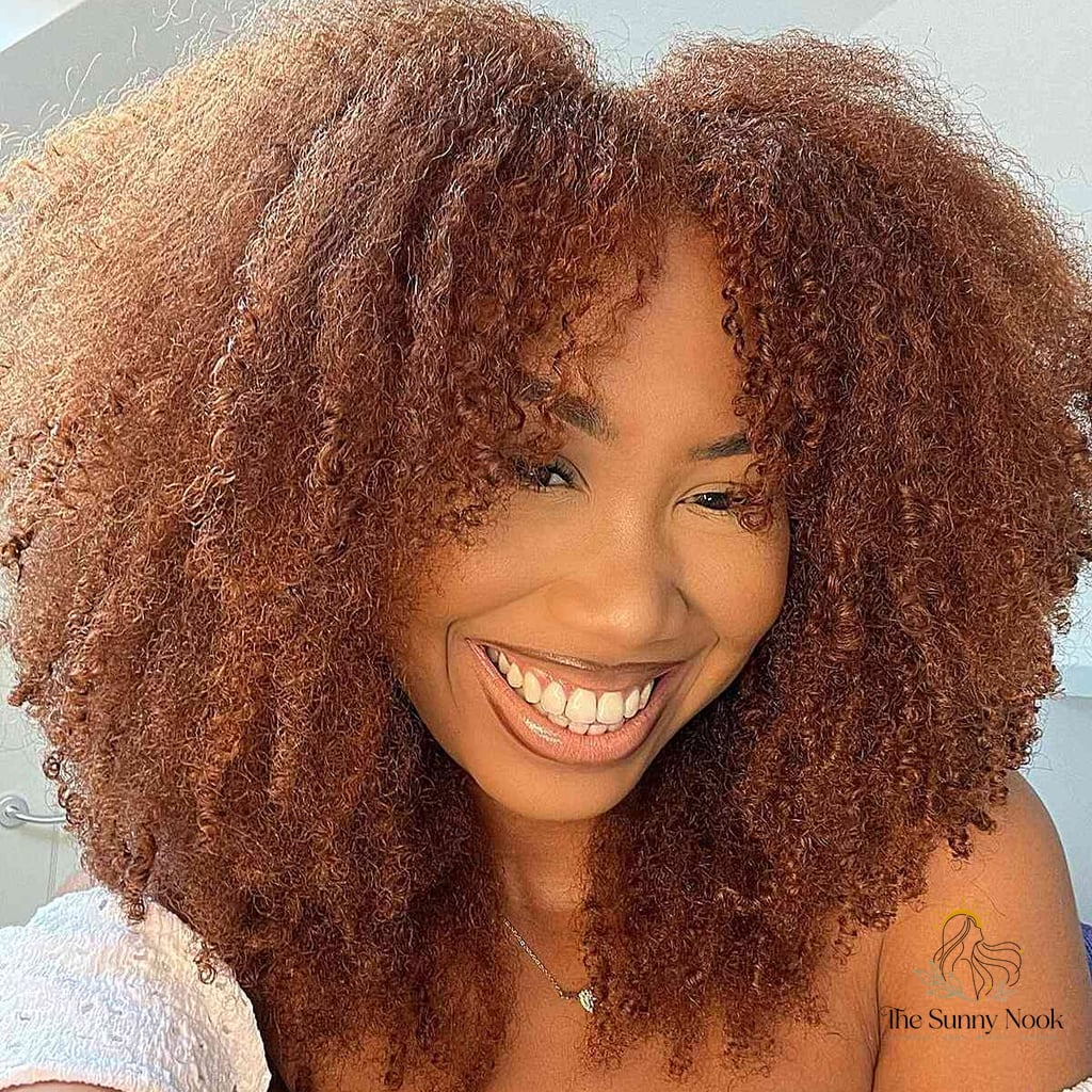 21 Hairstyles For Thick Hair Medium to Save Before They Blow Up 17 Fluffy Layered Cut with Natural Curls