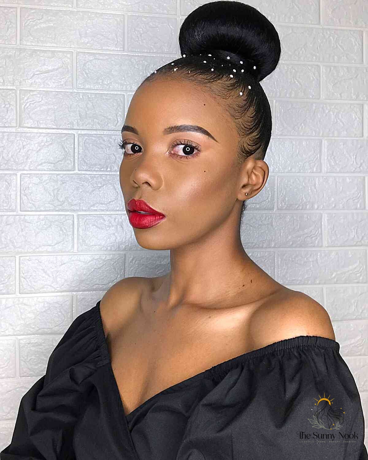 27 Slick Bun Hairstyles We're Obsessed With Right Now 22 High Ballerina Bun with Mini Pearls