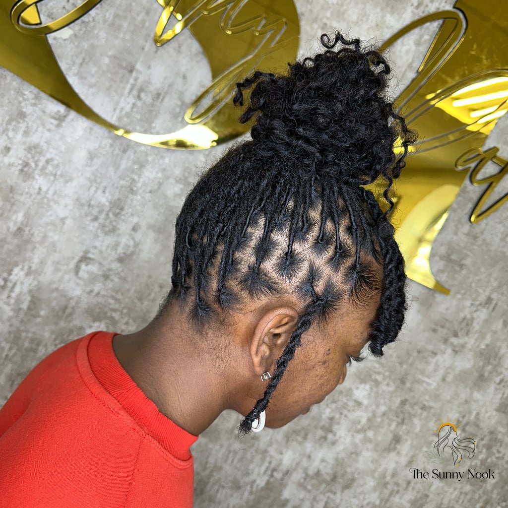 High Bun With Loose Strands and a Lot of Texture