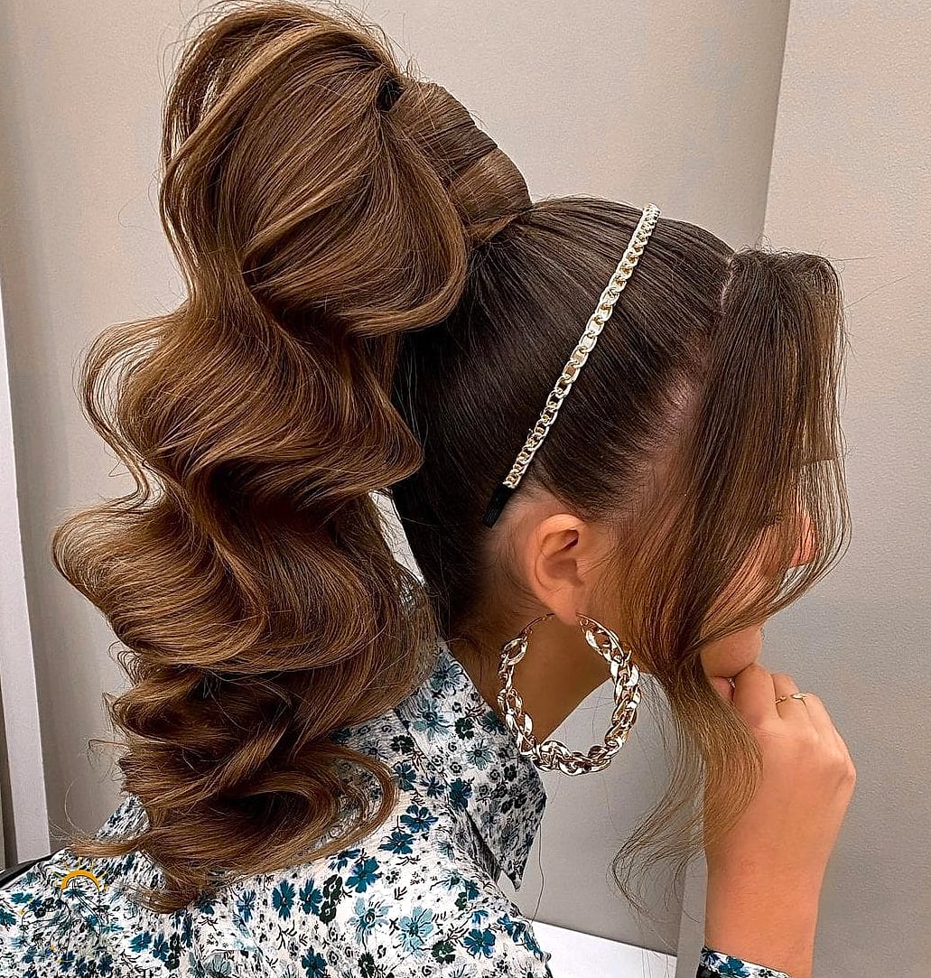 27 Ponytail Hairstyles Short Hair You'll Want to Re-Create Immediately 11 High and Wavy with a Bow