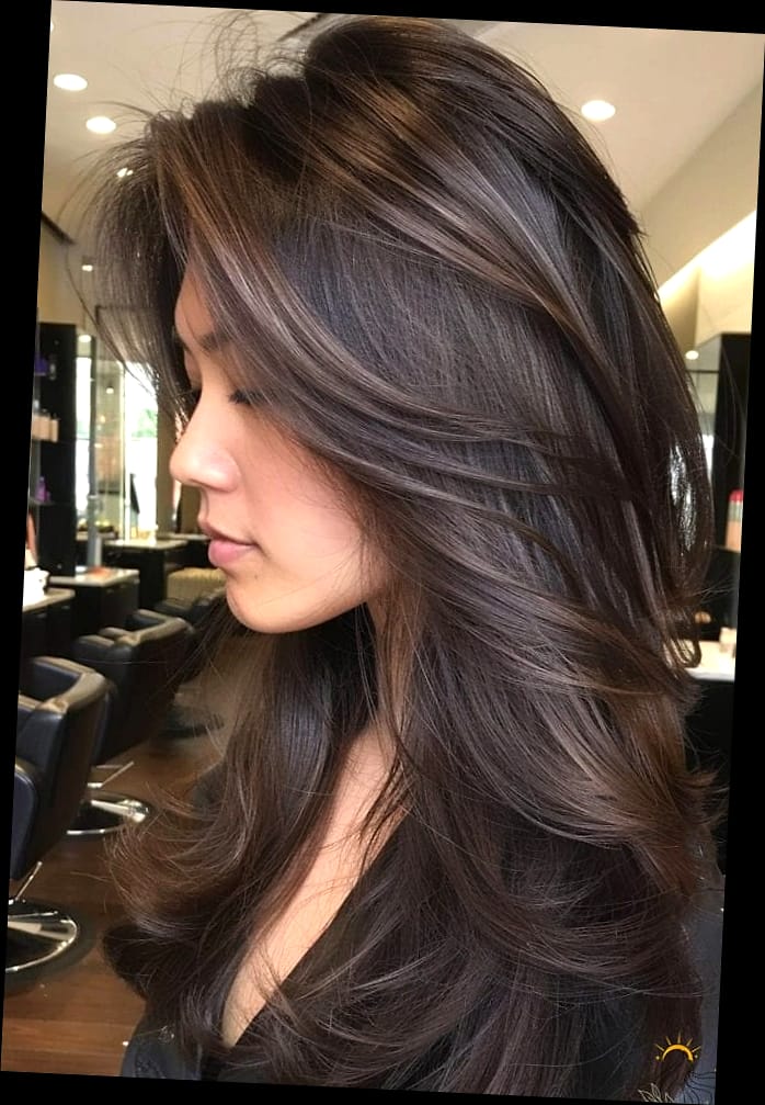 11 Gorgeous Hairstyles For Short Layered Hair for Every Hair Type 8 Layered Dark Brown Haircut With Soft Feathers Framing The Face