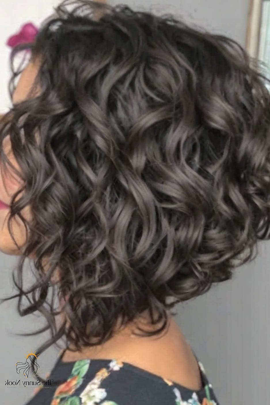 30 Elegant Hairstyles For Curly Hair We're Obsessed With Right Now 16 Layered Inverted Bob for Thick Curly Hair
