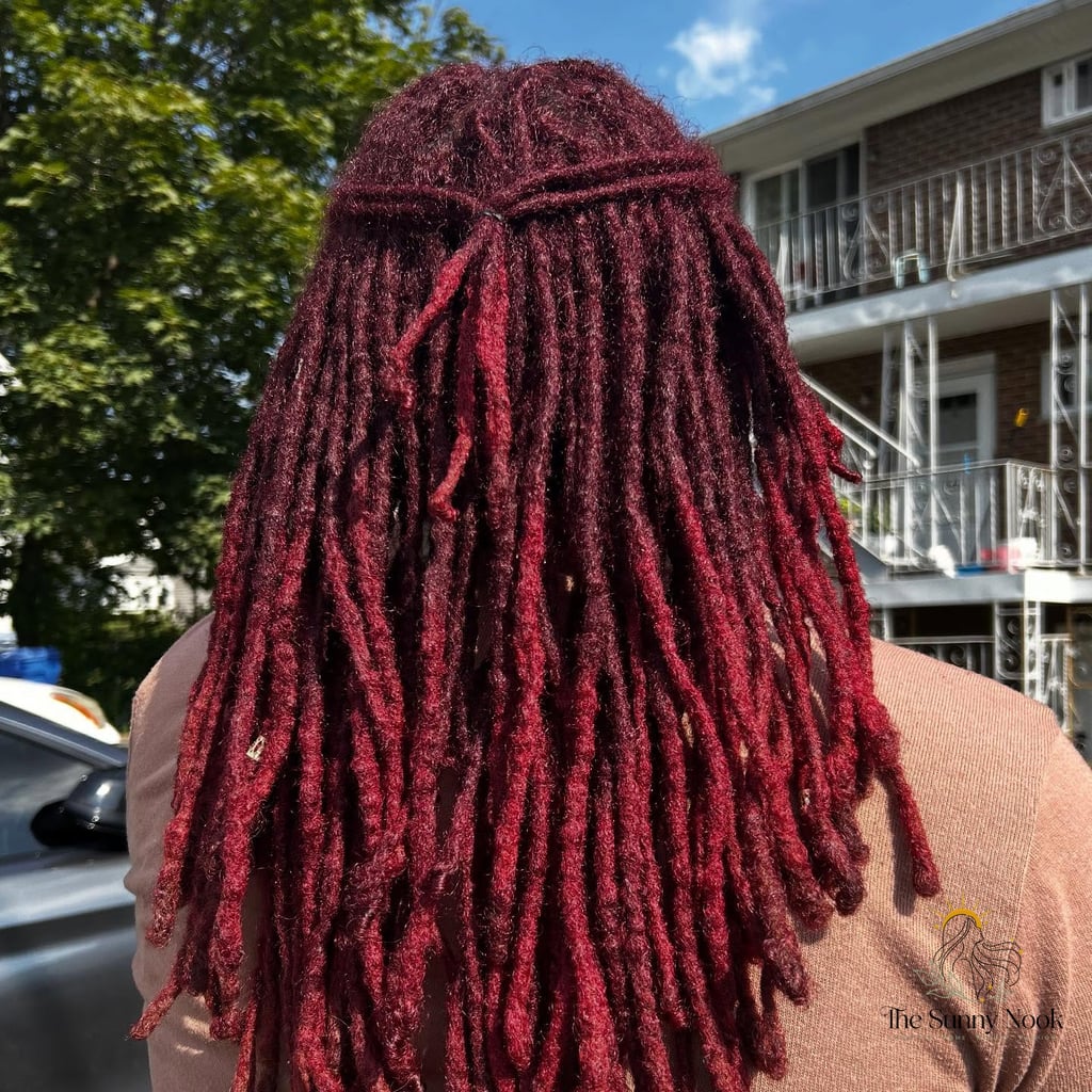 Long Red Locs Pulled Into a Half-Up Twist