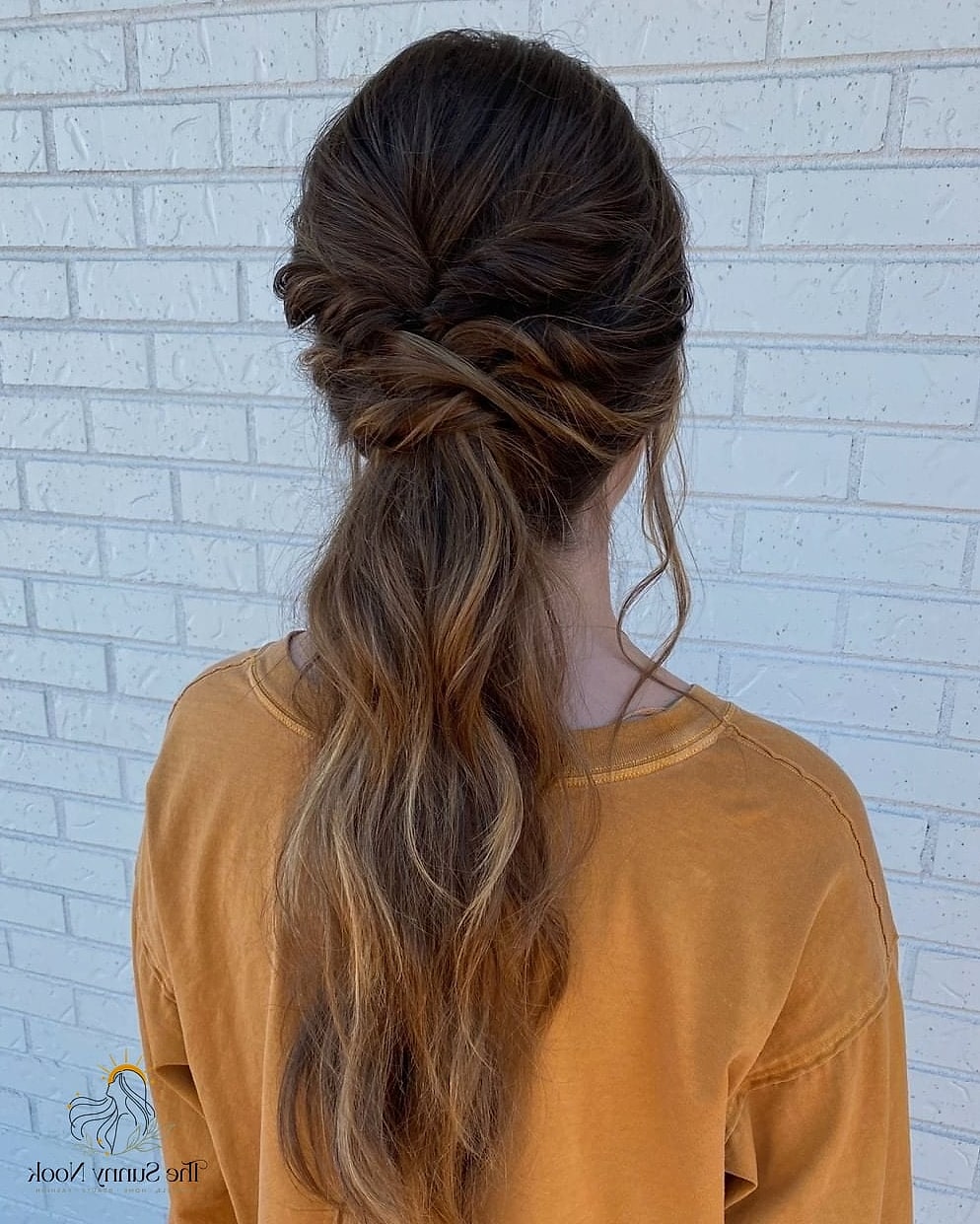 11 Gorgeous Loose Braid Hairstyles for Every Hair Type 9 Loose Braided Low Bun