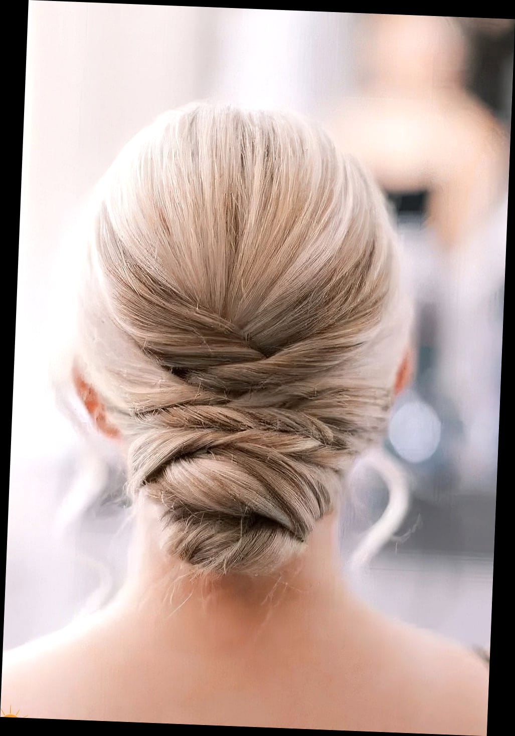 Low Bun with a Sleek Bump at the Crown