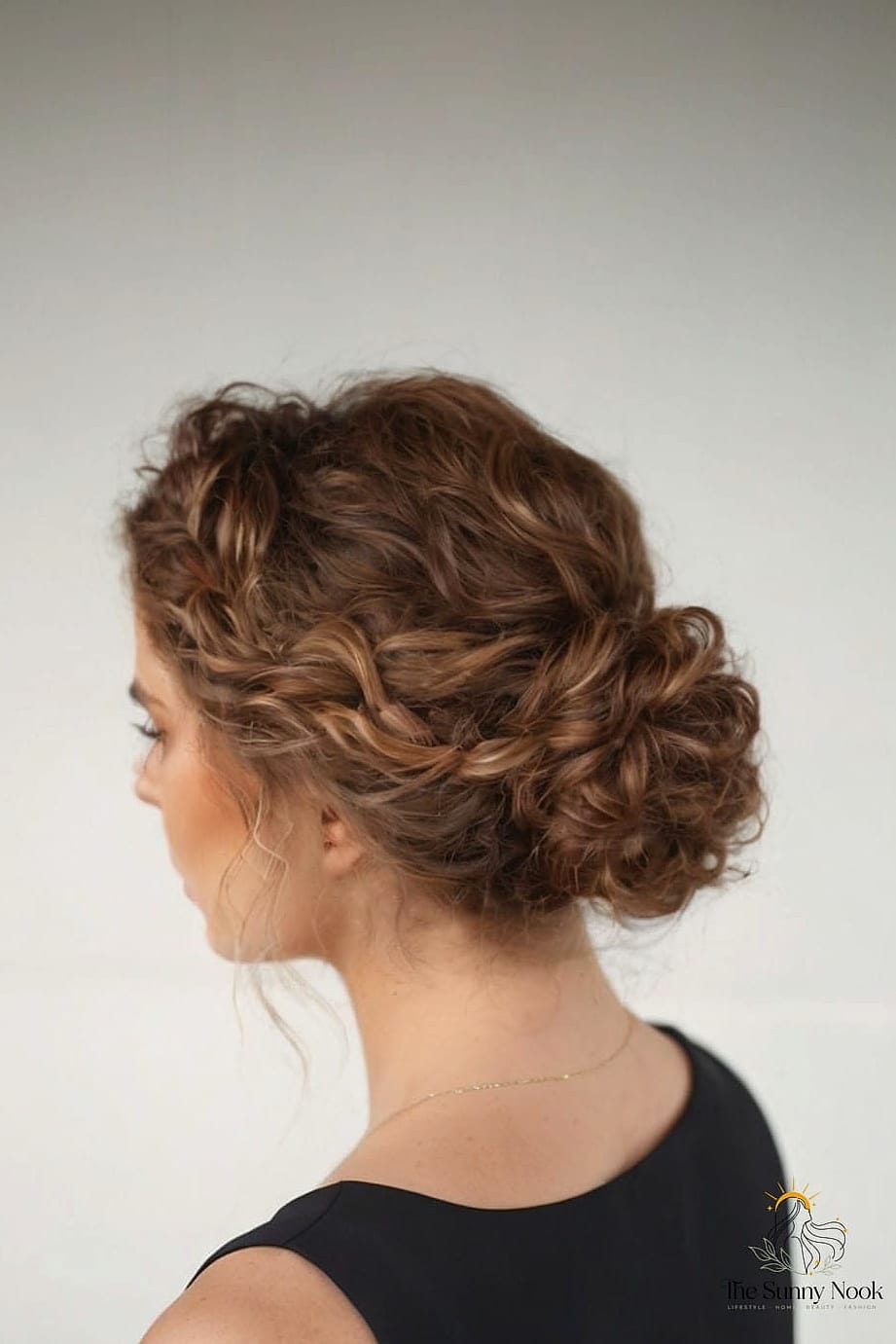 18 Updo Curly Hairstyles to Transform Your Look Instantly 10 Low Sock Bun