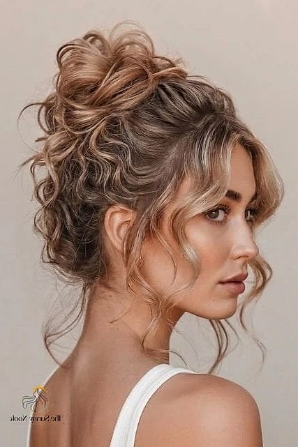 21 Gorgeous Hairstyles For Wavy Curly Hair for Every Hair Type 17 Messy Bun with Volume