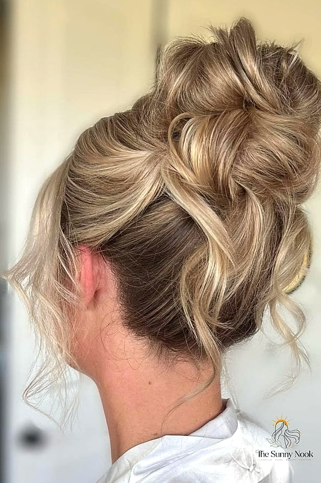 23 Hairstyles For Thick Curly Hair Looks That Will Seriously Inspire You 3 Messy Bun with an Accent Braid