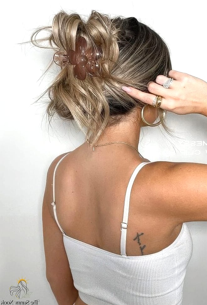 19 Claw Clip Hairstyles Curly Hair Ideas You Need to Try Right Now 8 Messy Top Knot with Claw Clip