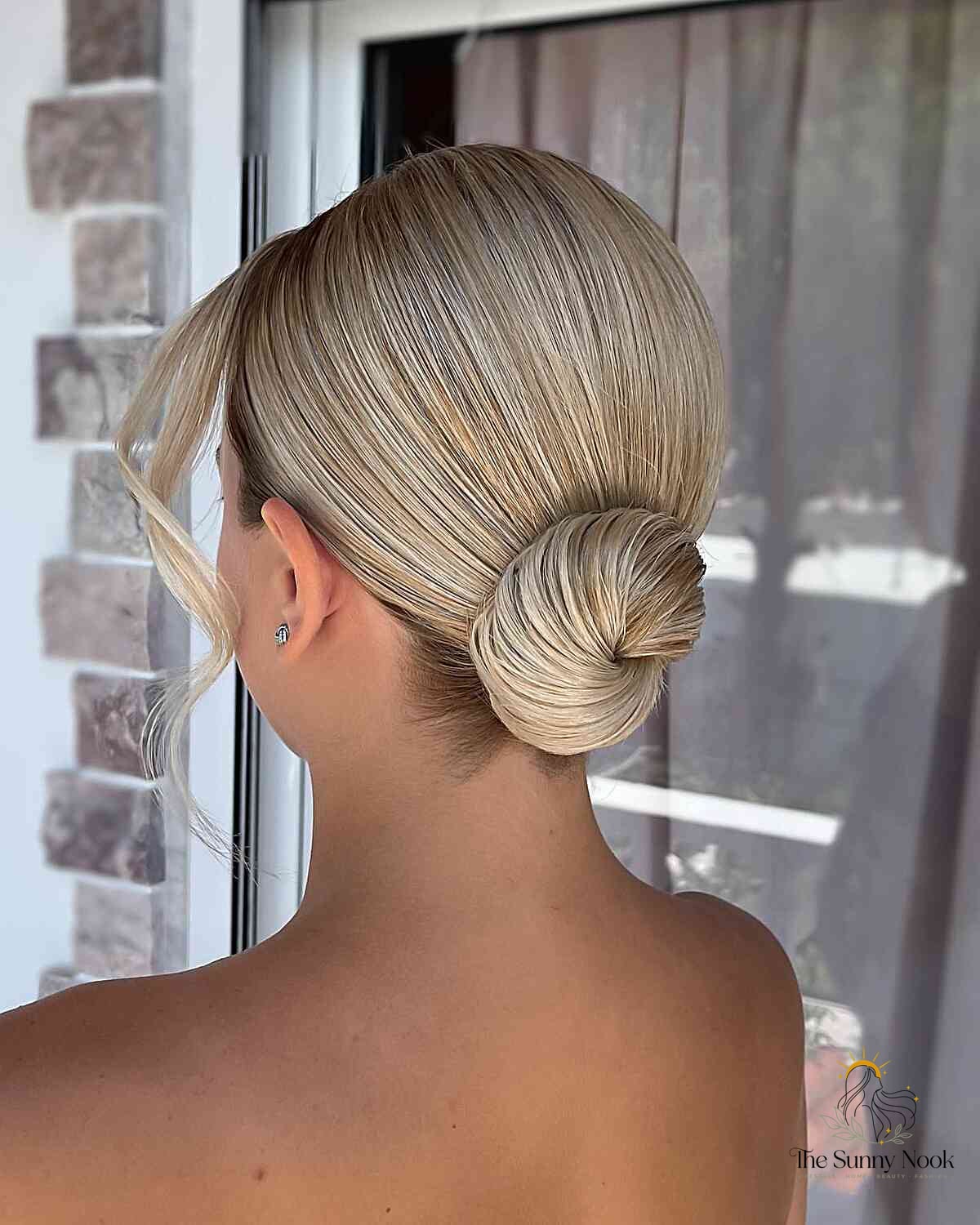 12 Side Bun Hairstyles We're Obsessed With Right Now 9 Romantic Blonde Low Bun