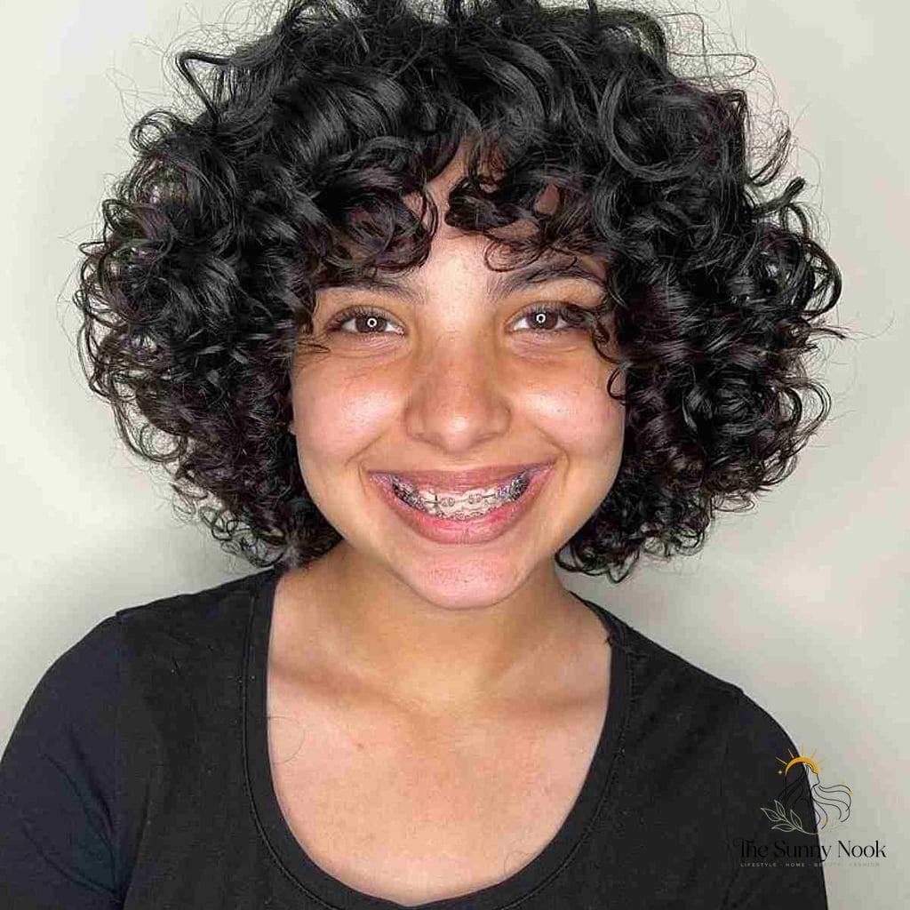 25 Hairstyles Short Curly Hair That Belong on Your Inspiration Board 9 Round-Shaped Layered Bob with Bouncy Curls
