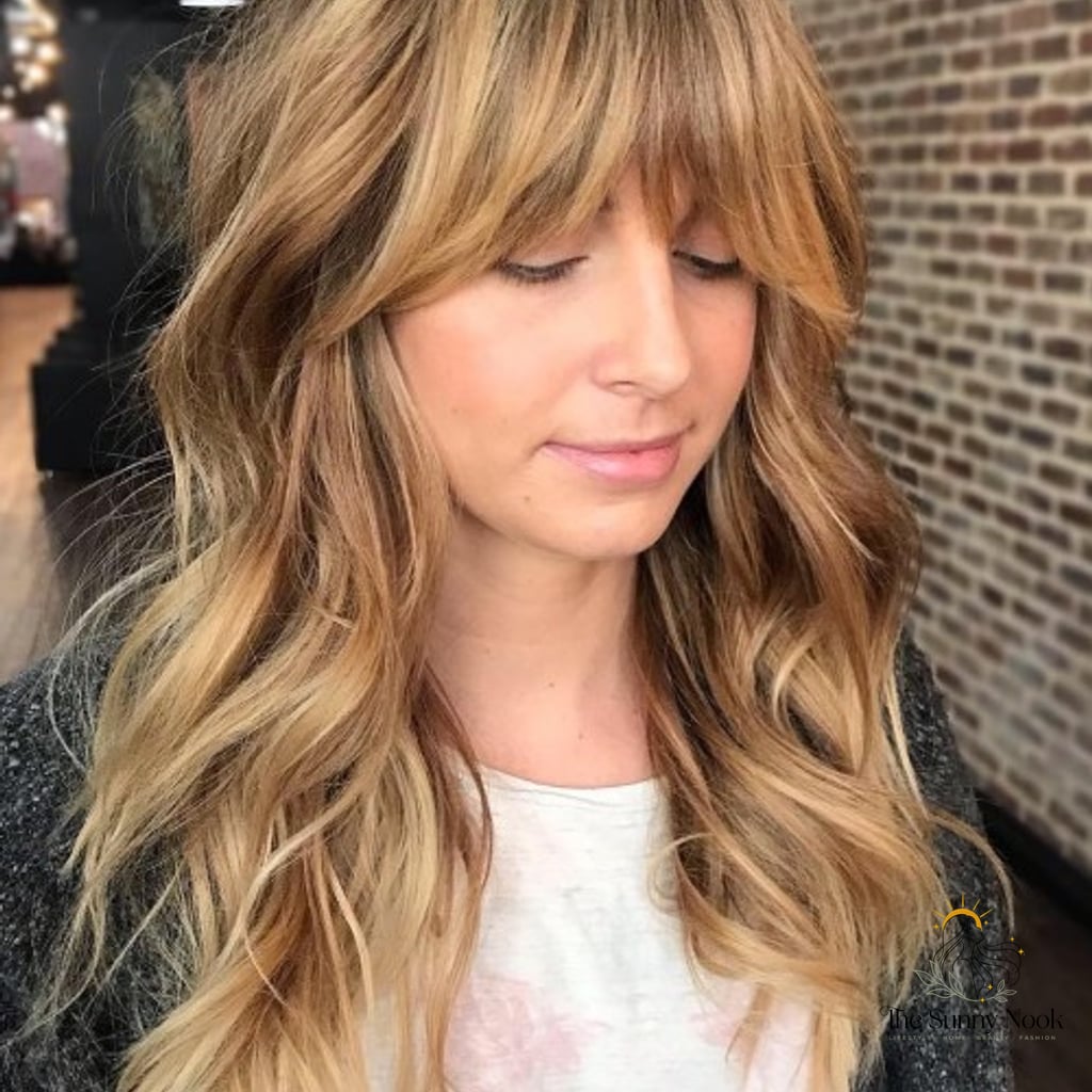 14 Tomboy Hairstyles For Long Hair to Transform Your Look Instantly 9 Shag with Long Arched Bangs