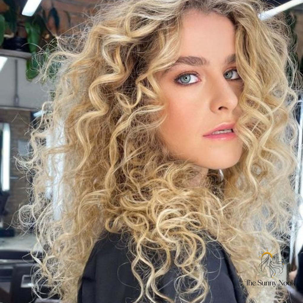 18 Gorgeous Curly Hair Inspo Hairstyles for Every Hair Type 8 Side-Swept Blonde Curls