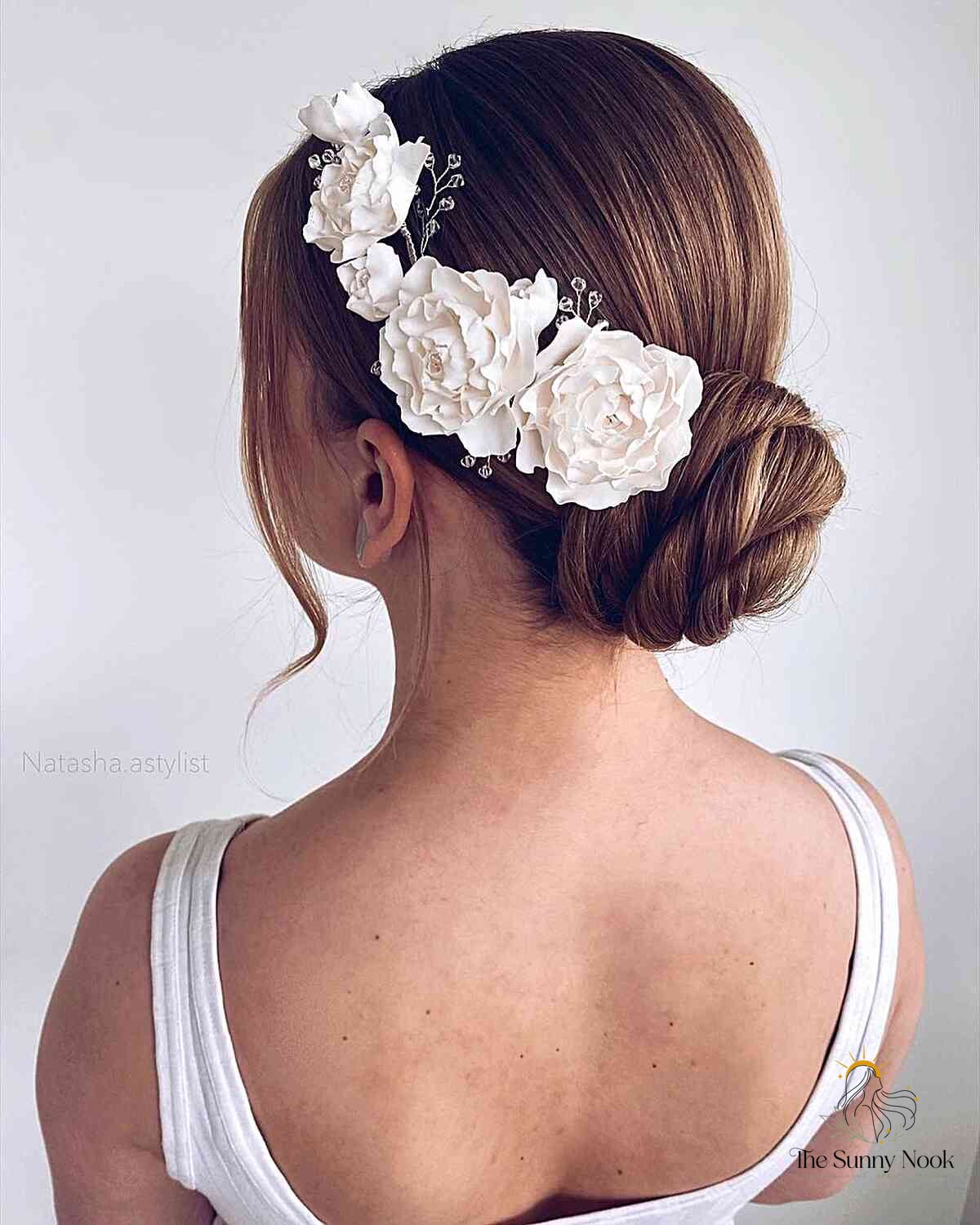 25 Wedding Hairstyles Updo We're Obsessed With Right Now 18 Simple and Modern Updo with Flowers
