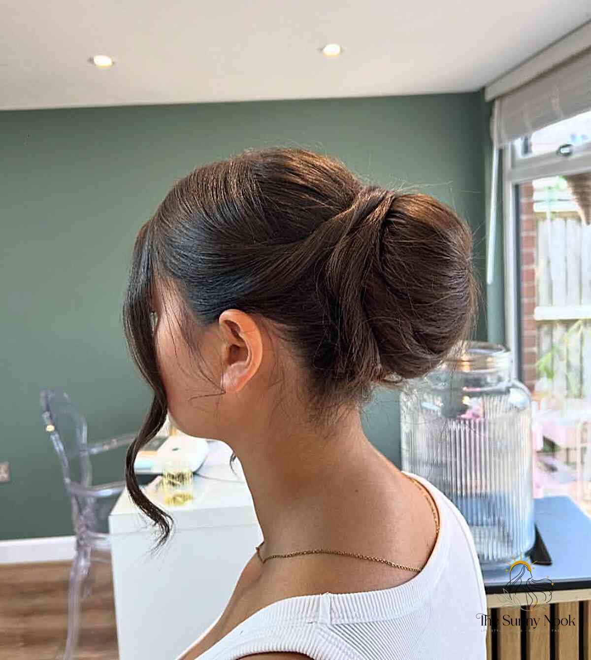 27 Slick Bun Hairstyles We're Obsessed With Right Now 28 Sleek Twisted Bun Updo