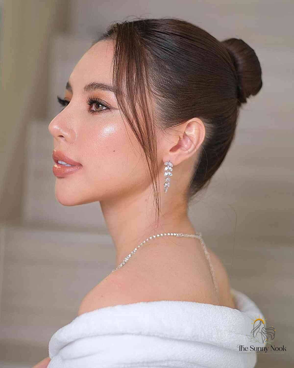 27 Slick Bun Hairstyles We're Obsessed With Right Now 11 Slick Bun with Front Pieces
