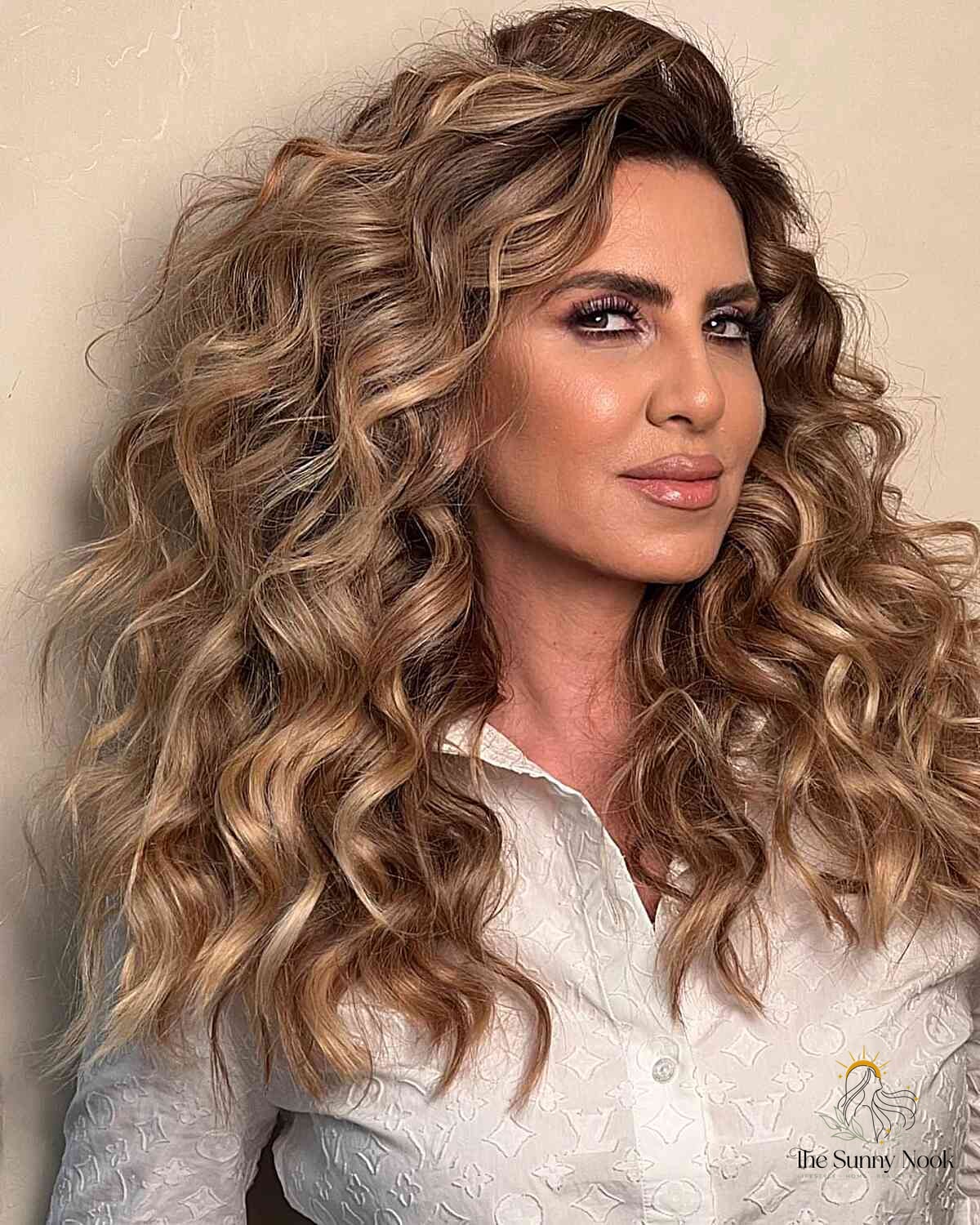 18 Updo Curly Hairstyles to Transform Your Look Instantly 5 Thick and Voluminous Golden Blonde Curls