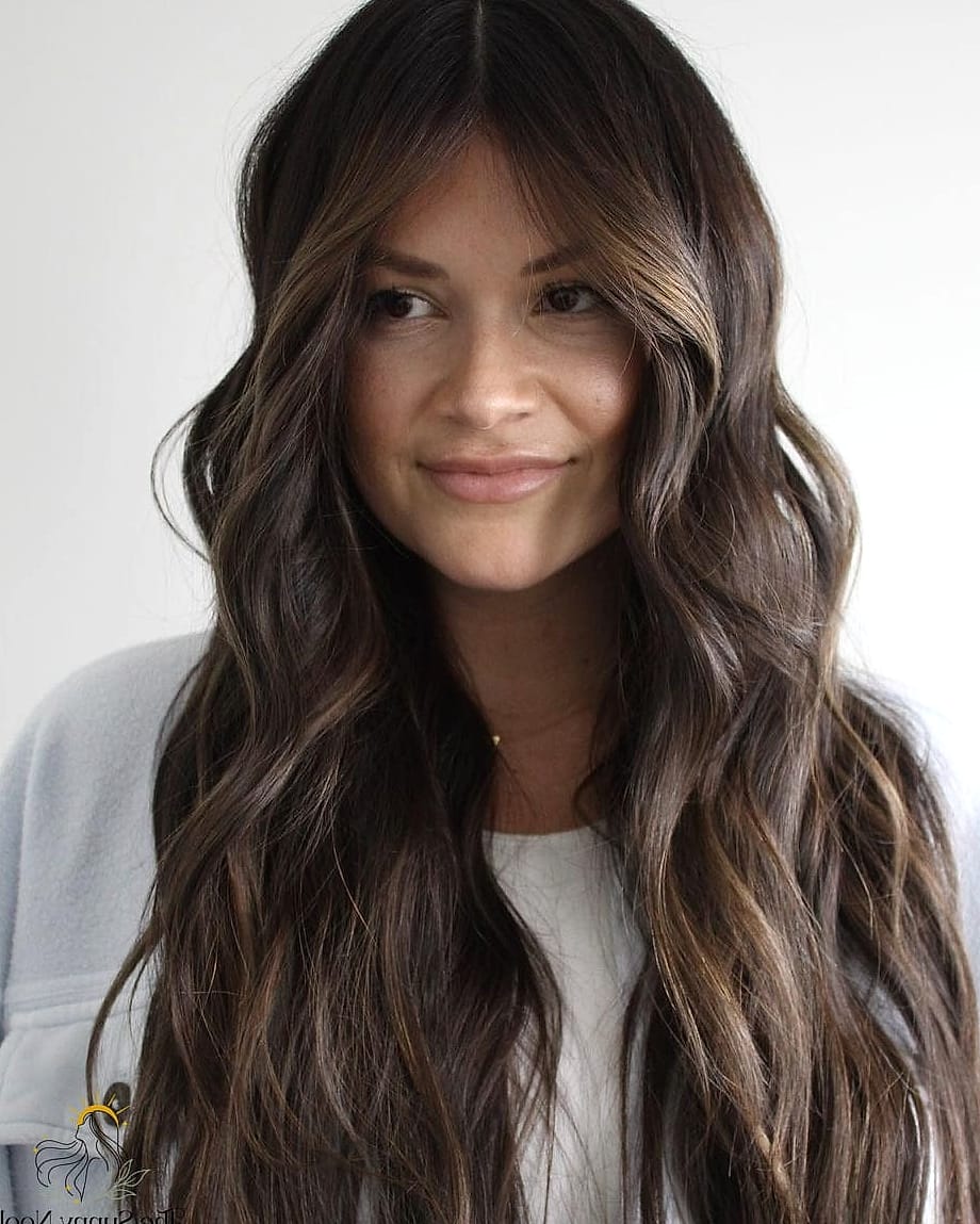 30 Cute Long Hairstyles You'll Want to Re-Create Immediately 30 Tousled Brunette Half-Up Pony with Soft Curls
