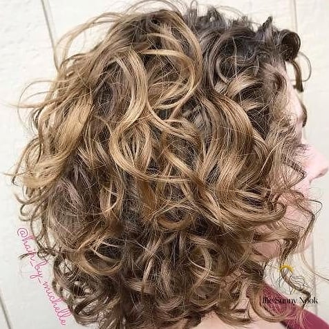 23 Hairstyles For Thick Curly Hair Looks That Will Seriously Inspire You 9 Tousled Large High Bun