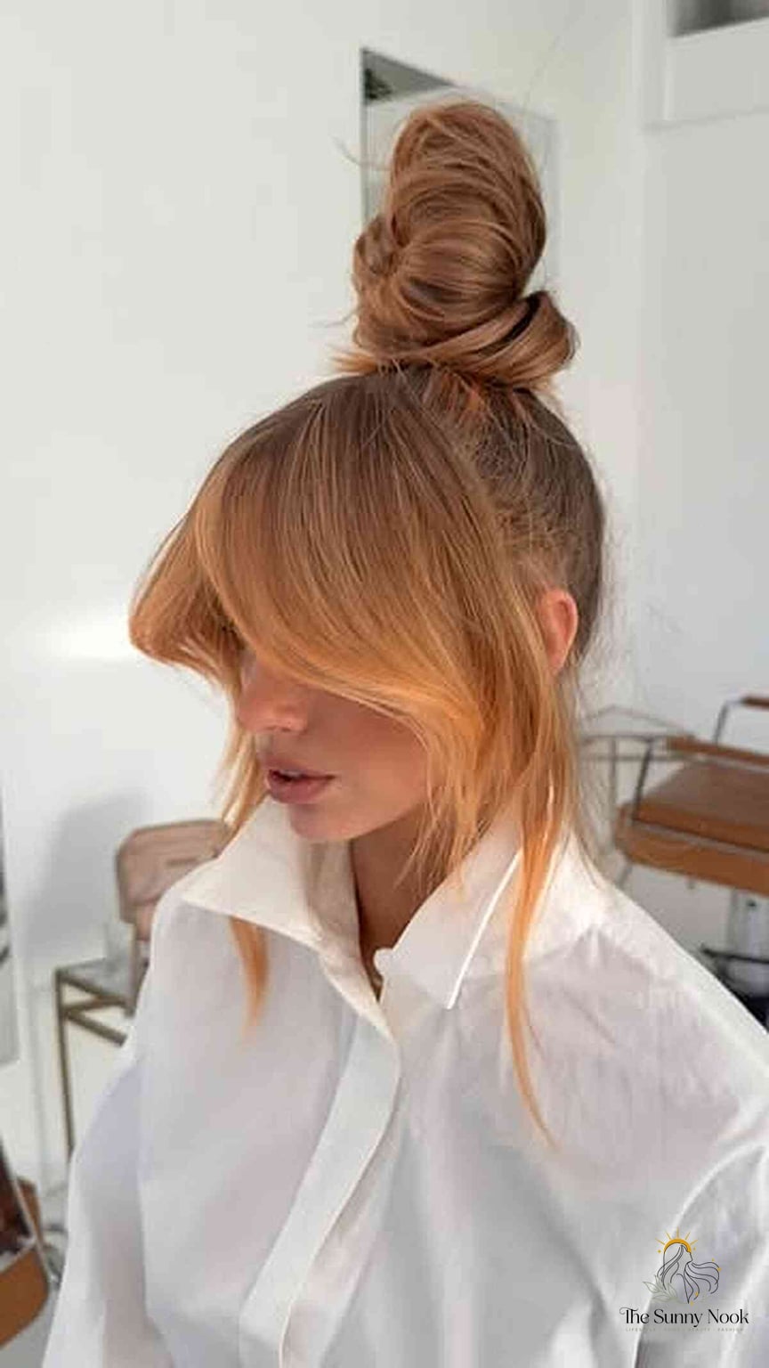 12 Side Bun Hairstyles We're Obsessed With Right Now 2 Trendy High Bun with Soft Bangs