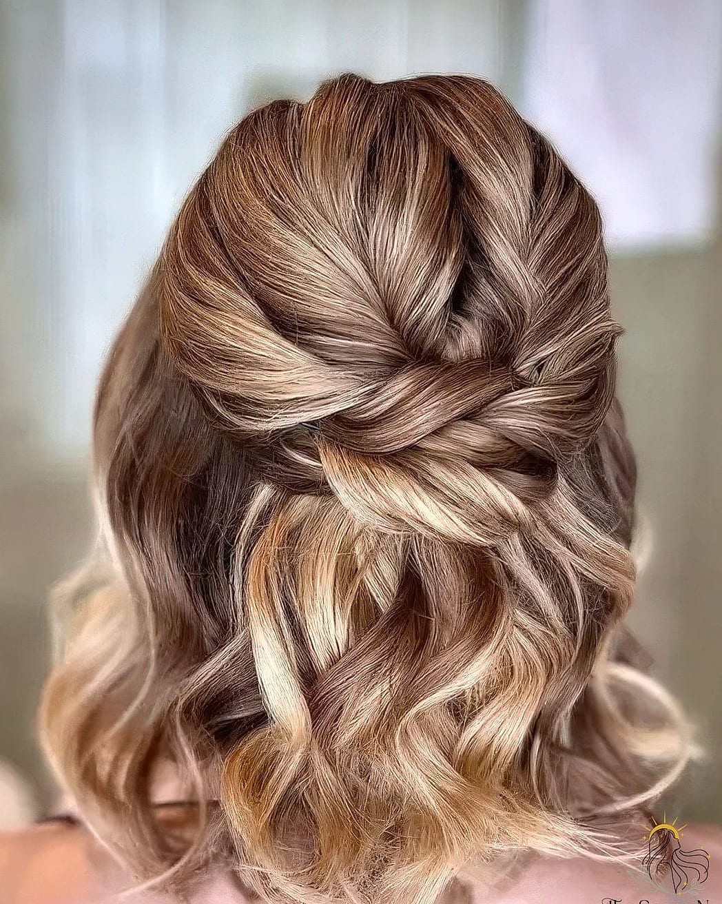 15 Hair Updos For Medium Hair to Transform Your Look Instantly 13 Twisted Half-Up With Bun