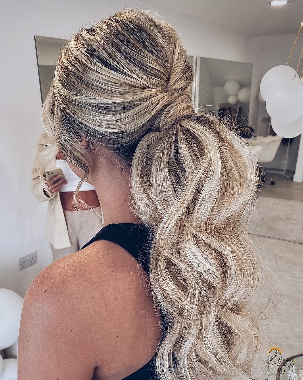 27 Ponytail Hairstyles Short Hair You'll Want to Re-Create Immediately 17 Wrapped Crown Braid Into a Low Braided Bun