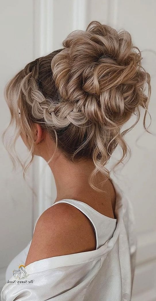 23 Updo Hairstyles For Prom Everyone Is Pinning Right Now 11 Braided Bun with Floral Accents
