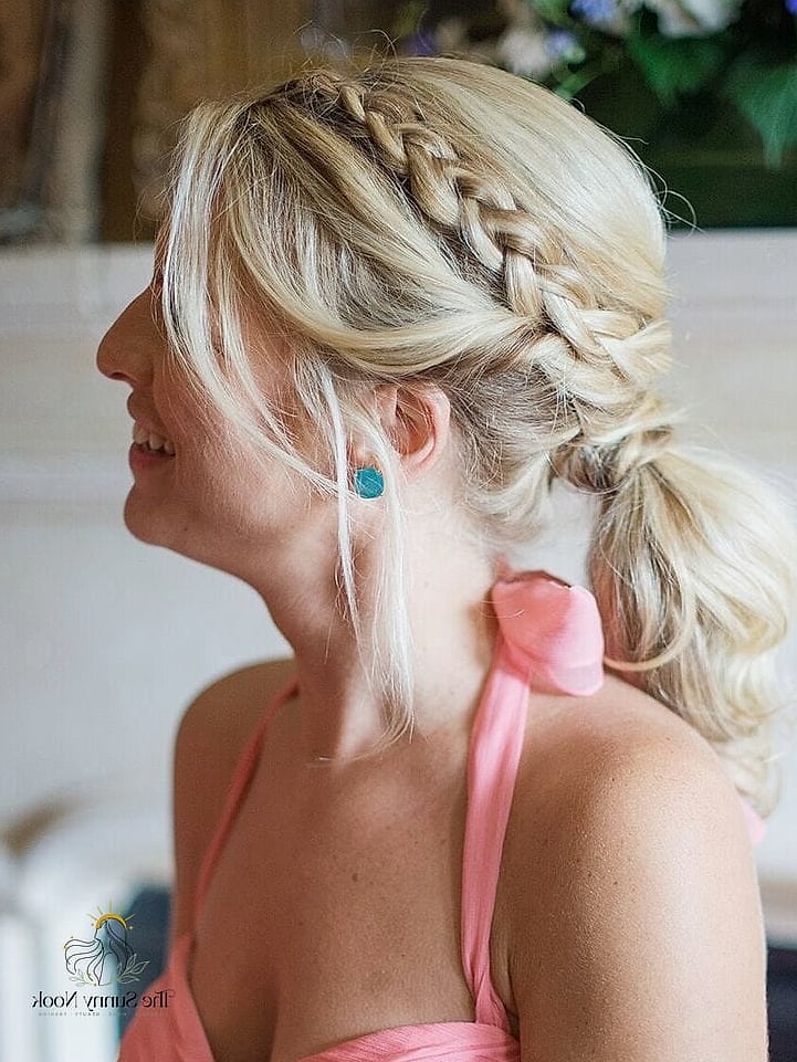 21 Simple Wedding Guest Hairstyles We're Obsessed With Right Now 8 Braided Low Bun