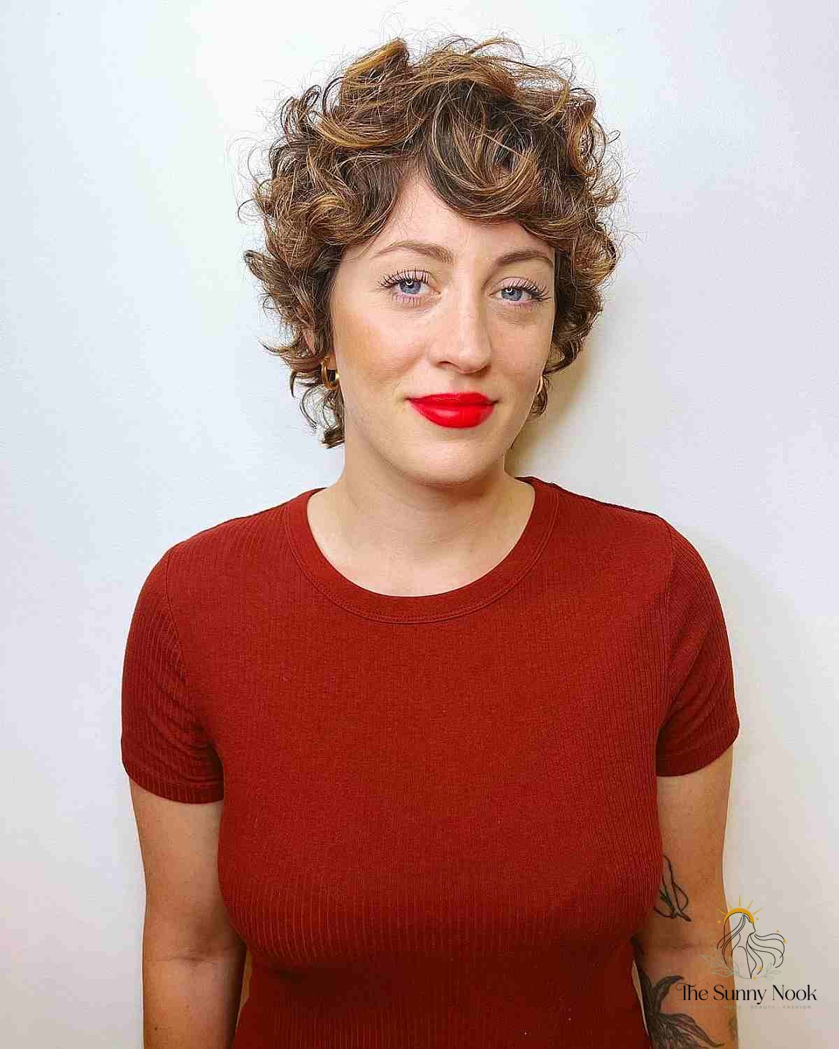 27 Hairstyles For Curly Hair Short Perfect for Your Next Salon Appointment 22 Bronde Textured Pixie with Curls