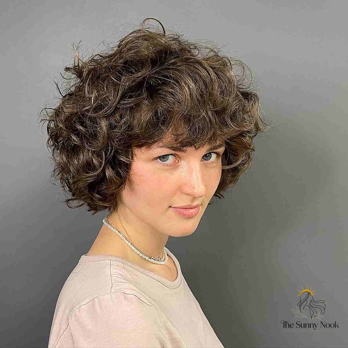 Brown Curly Bob with Razor Cut Layers and Bangs