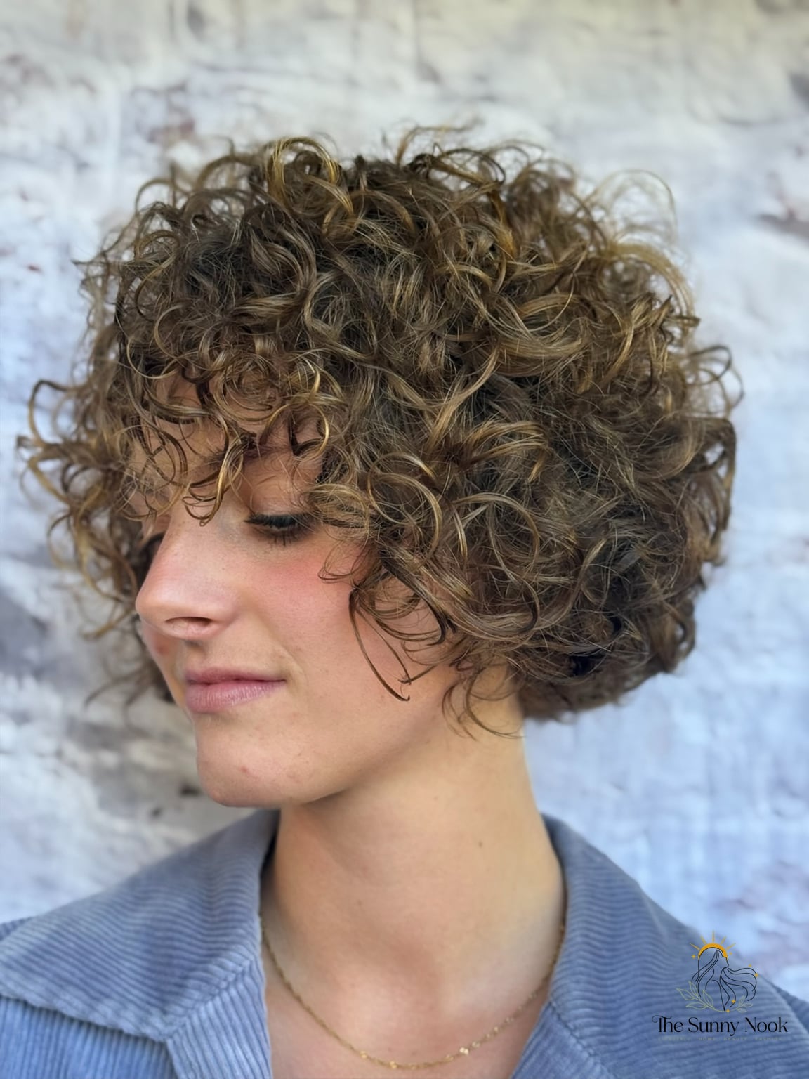 27 Hairstyles For Curly Hair Short Perfect for Your Next Salon Appointment 15 Chin-Length Curly Bob with Sneaky Good Layering