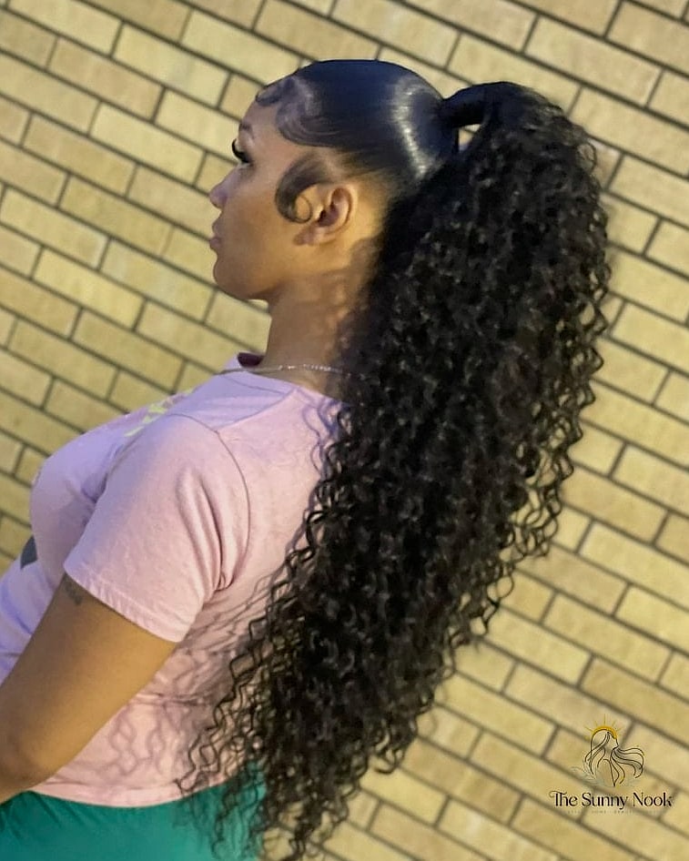 23 Slick Ponytail Hairstyles That Work on Every Hair Length 6 Curly Ponytail with Natural Definition