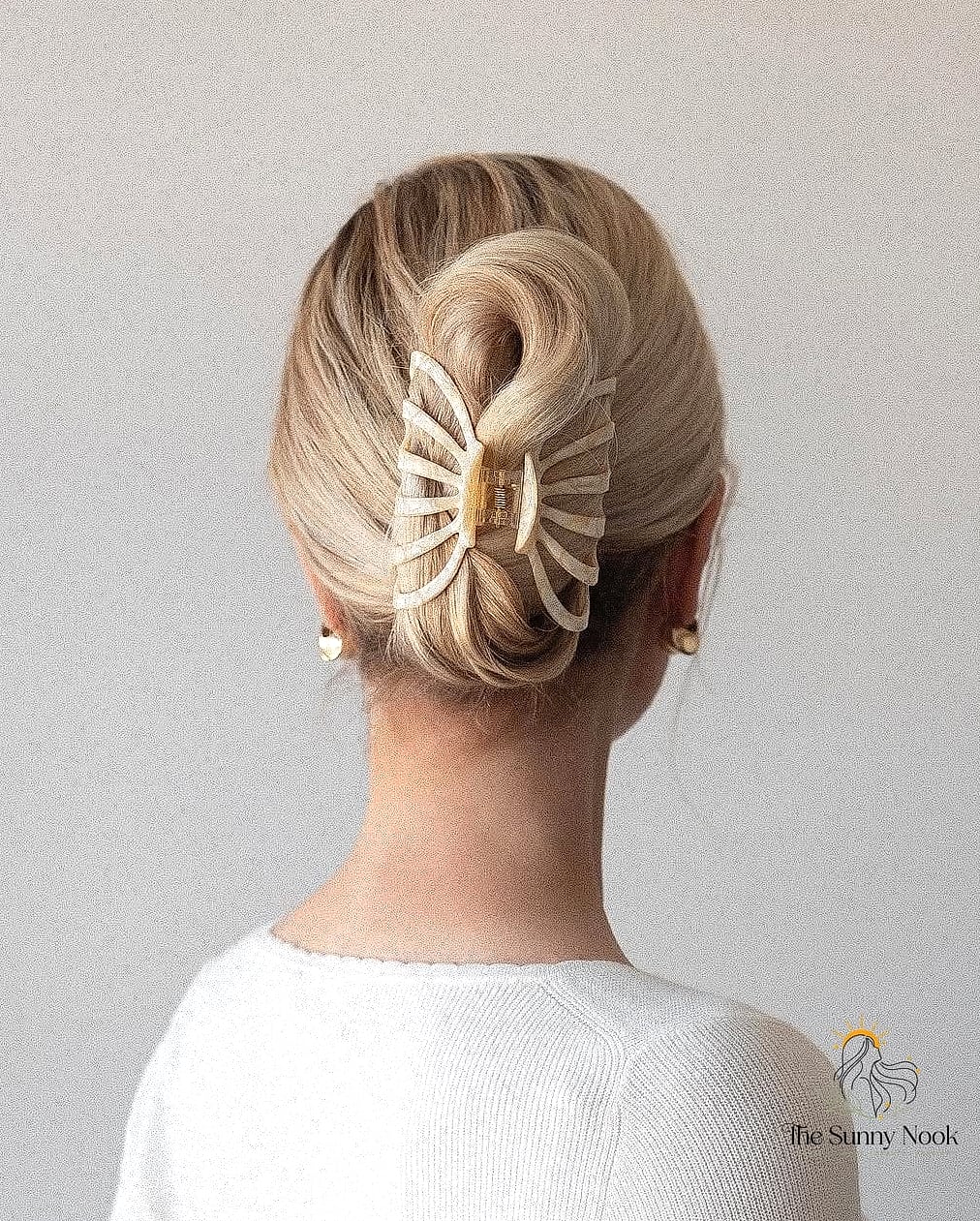 Elegant Claw Clip Updo with Floral Accent