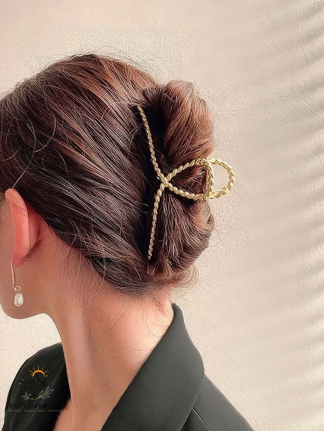 Elegant Claw Clip Updo with Floral Accent