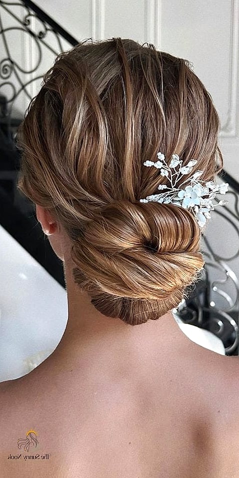 22 Classy Updo Hairstyles That Prove This Trend Is Here to Stay 17 Glamorous Side Bun with Waves