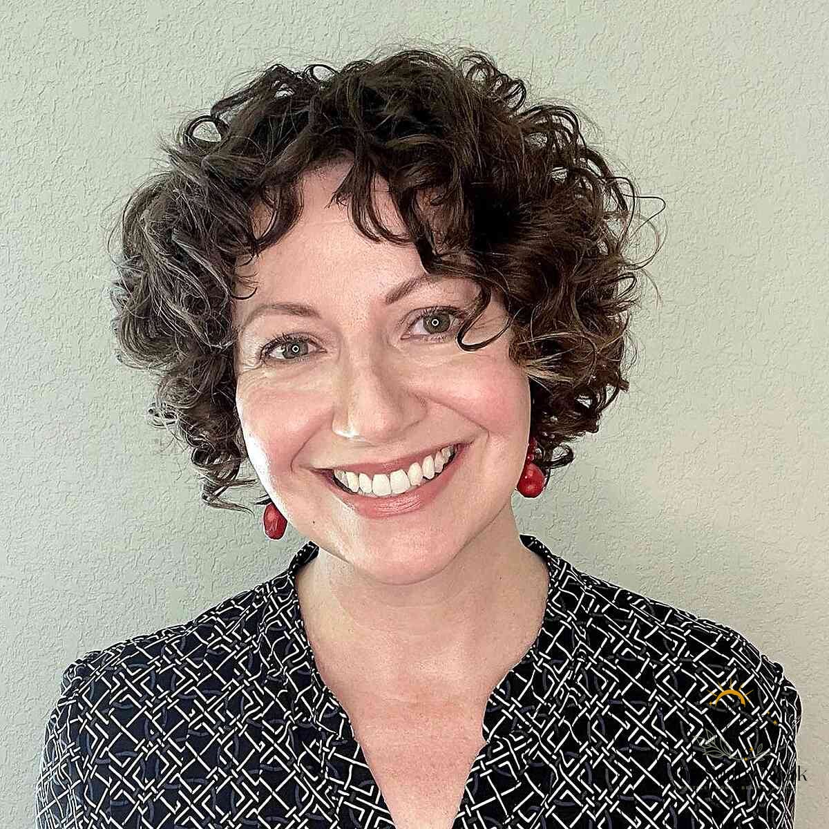 27 Hairstyles For Curly Hair Short Perfect for Your Next Salon Appointment 18 Glowing Curly Bob with Fun Fringe