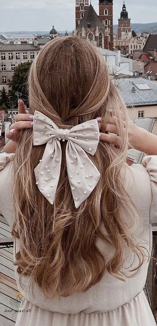 7 Cute Hairstyles With Bows for When You Need a Fresh Change 8 High Bow Ponytail With Volume