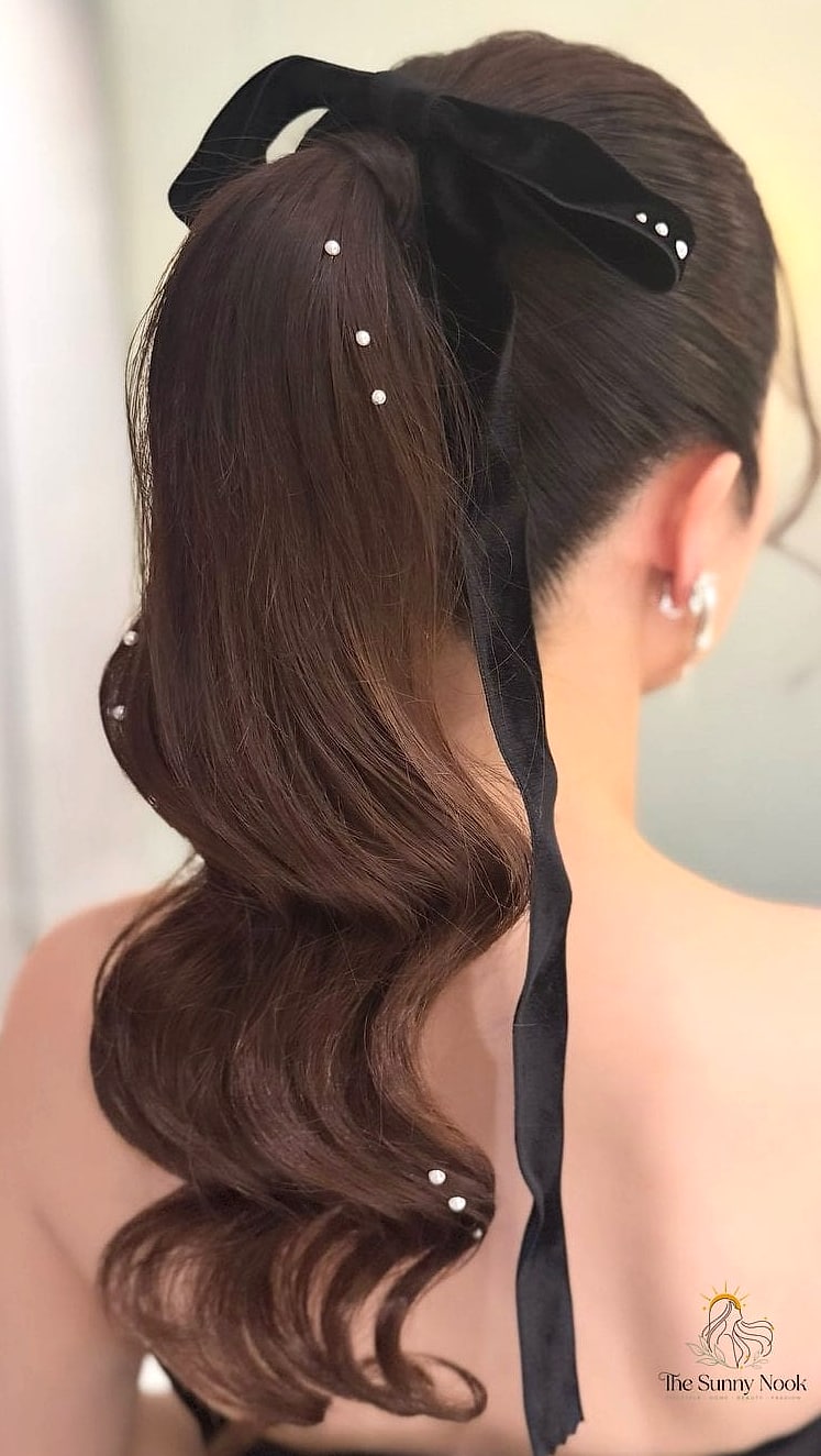 25 Cute Hairstyles With A Bow Everyone Is Pinning Right Now 14 High Ponytail With A Statement Bow