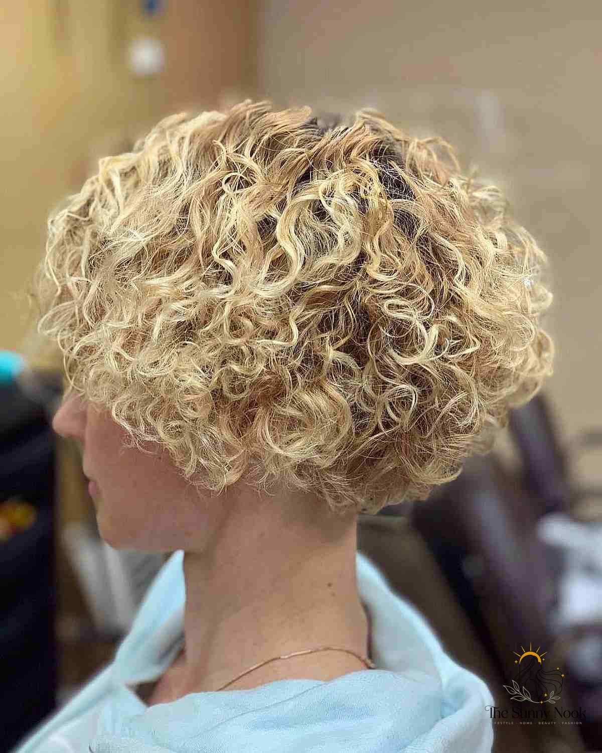 27 Hairstyles For Curly Hair Short Perfect for Your Next Salon Appointment 3 Inverted Bob for Rooted Blonde Curly Hair